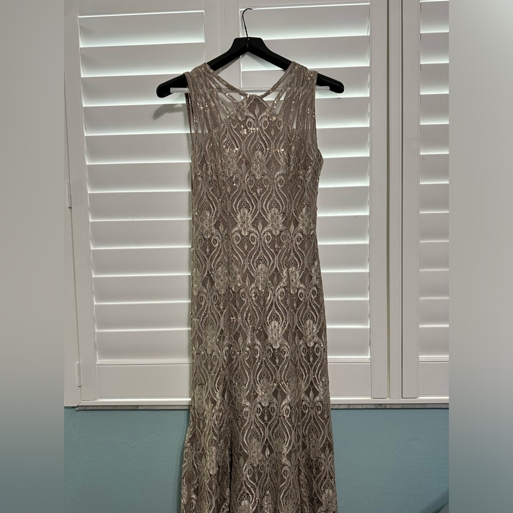 gold and grayish dress with beautiful designs and sparkly features